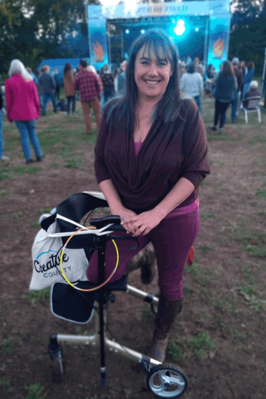 Katherine A. DeSilva, with mobility device